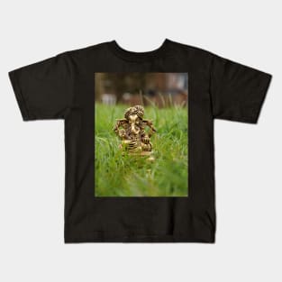 Brass statue of Lord Ganesha on the grass Kids T-Shirt